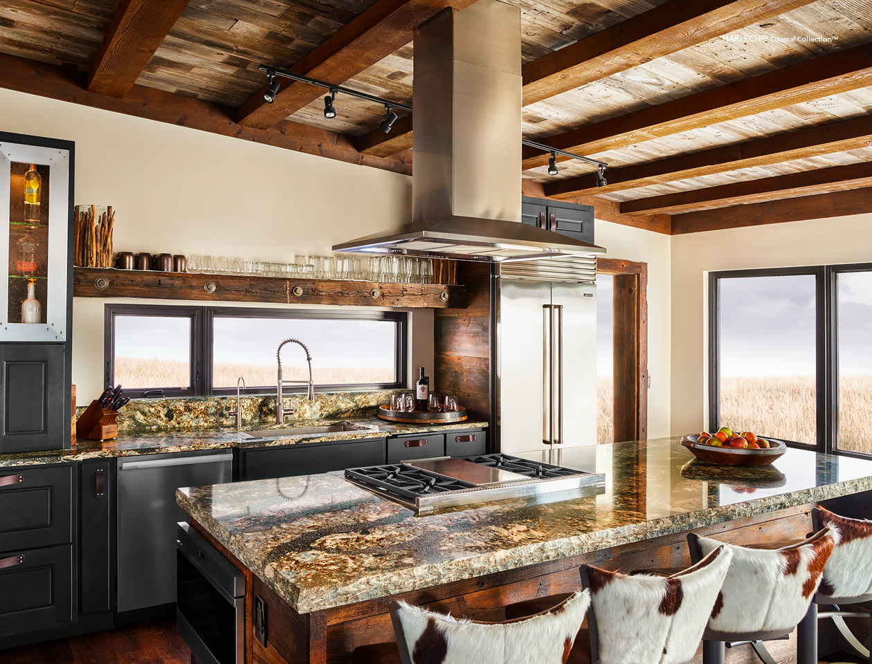 Harlech Cambria Quartz Kitchen Countertops with Brown Wood Cabinets, Stainless Steel, and Bar Stools