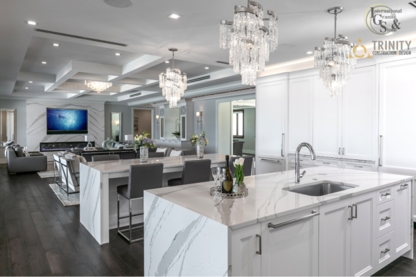 Cambria Brittanica Kitchen Countertops Bathroom Countertops White and Gray Quartz Countertops White Cabinets Kitchen Island marble looking quartz International Granite and Stone Trinity Construction and Design Collaboration gray furniture gray flooring white tile white backsplash