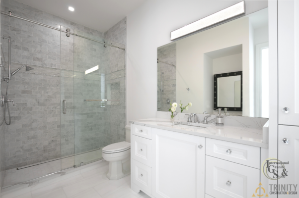 Cambria Brittanica Kitchen Countertops Bathroom Countertops White and Gray Quartz Countertops White Cabinets Kitchen Island marble looking quartz International Granite and Stone Trinity Construction and Design Collaboration gray furniture gray flooring white tile white backsplash