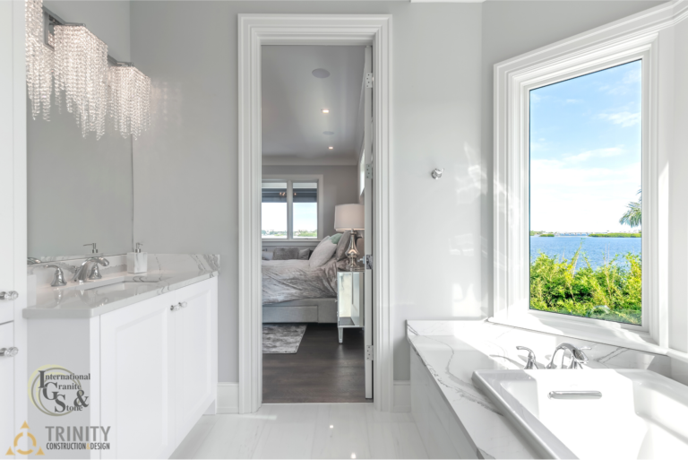 Cambria Brittanica Kitchen Countertops Bathroom Countertops White and Gray Quartz Countertops White Cabinets Kitchen Island marble looking quartz International Granite and Stone Trinity Construction and Design Collaboration gray furniture gray flooring white tile white backsplash