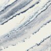 Close-up view of Cambria Inverness Bristol Bay Quartz countertop featuring stormy-blue waves, cool white backdrop, and debossed Inverness veins, showcasing its high gloss finish and durability for residential and commercial applications.