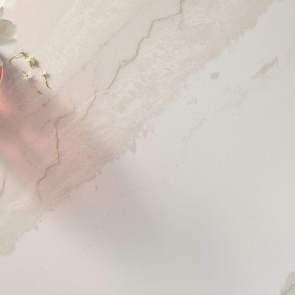A close-up view of Cambria Inverness Swansea Quartz, showcasing its tonal white, marbled design with intricate debossed Inverness veins. Available in both high gloss and Cambria Matte finishes