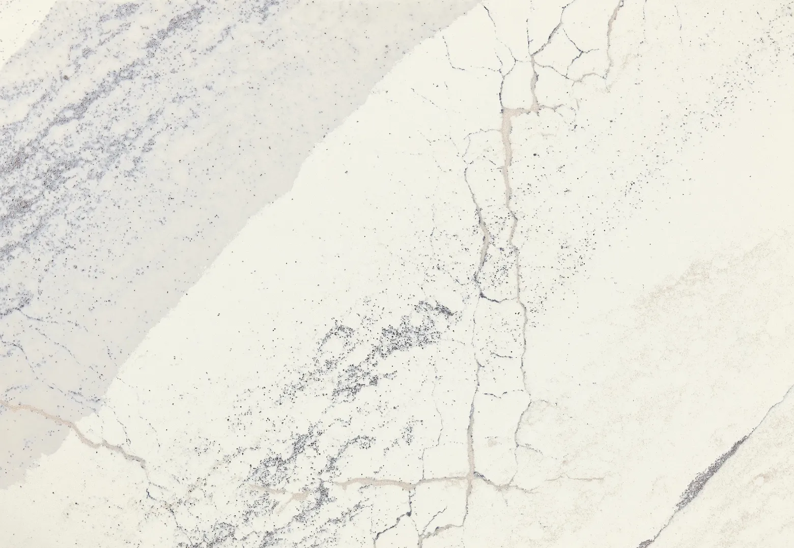 Close-up view of Cambria Windsor Steel Satin Ridge Quartz, showcasing its steel-toned wave patterns, warm honey-colored sand backdrop, and contrasting cool charcoal elements.